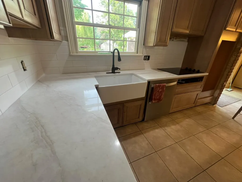 Bright kitchen with new counters, sink and backsplash