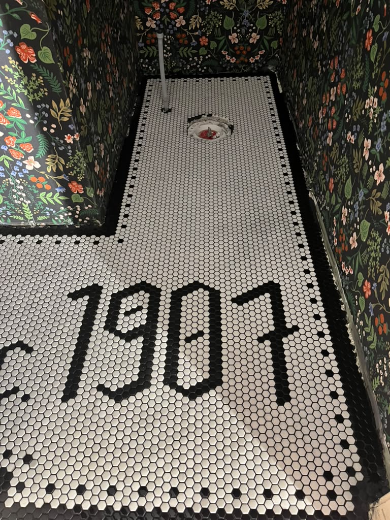 Black and white penny tile bathroom project