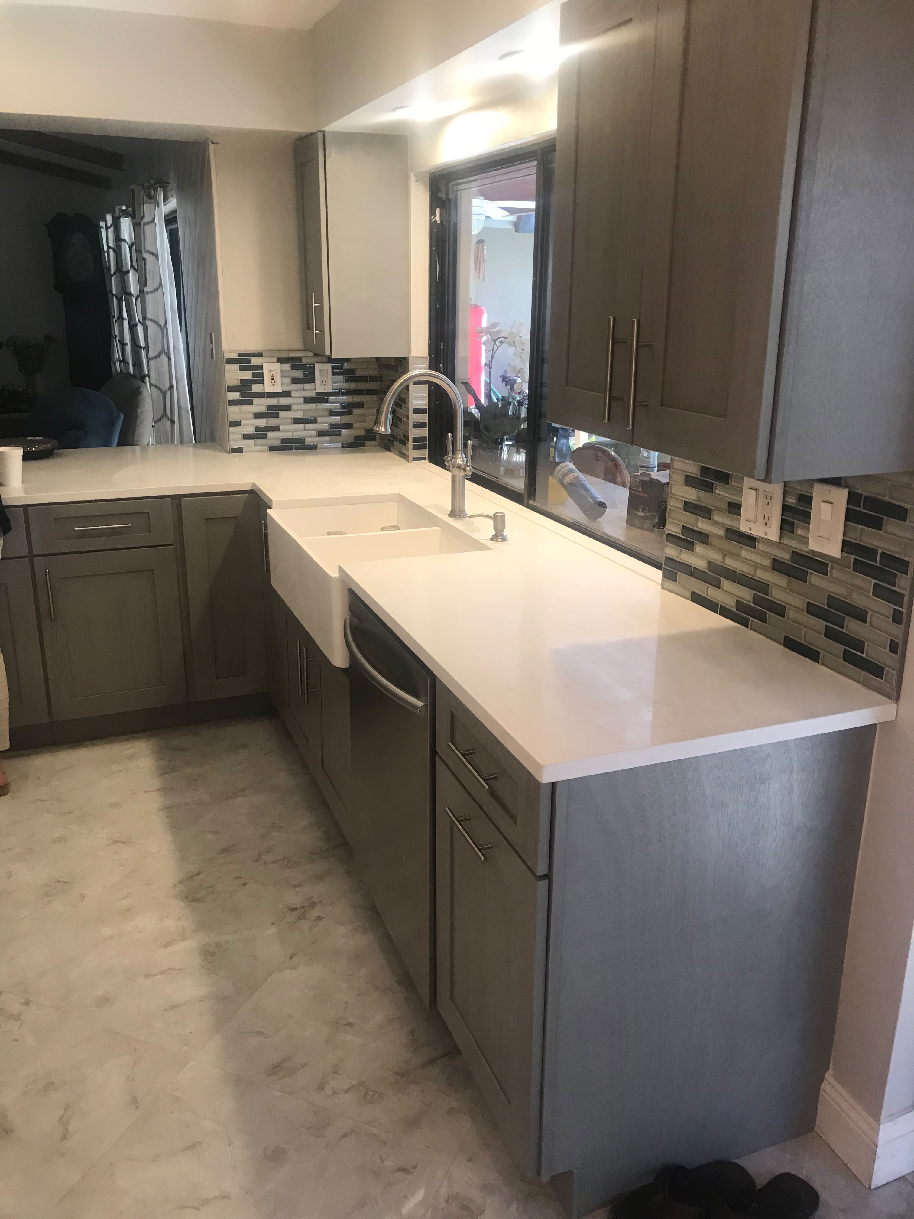 Gray kitchen cabinets and farmhouse sink