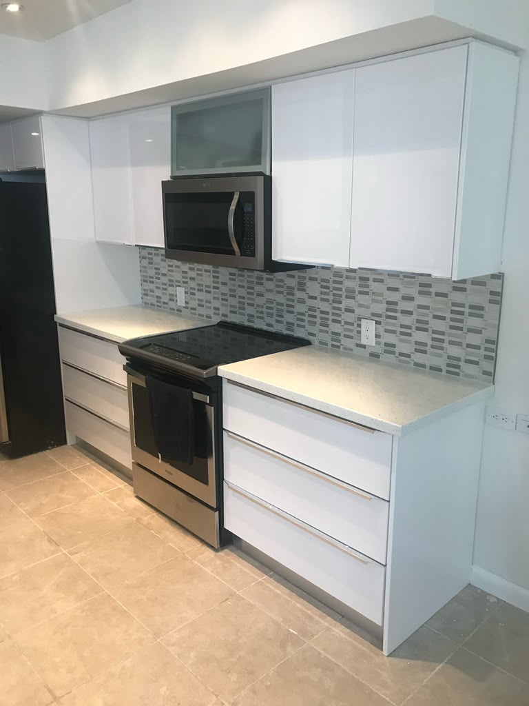 Modern white kitchen with integrated appliances